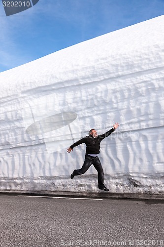 Image of highway along the snow wall. Norway in spring