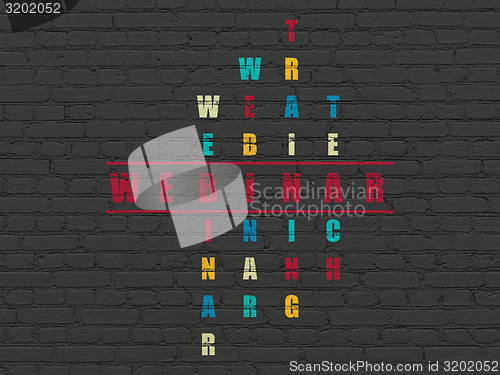 Image of Education concept: word Webinar in solving Crossword Puzzle