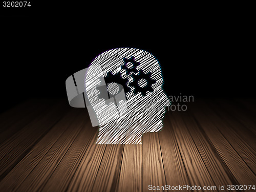 Image of Education concept: Head With Gears in grunge dark room