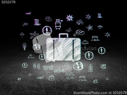 Image of Travel concept: Bag in grunge dark room