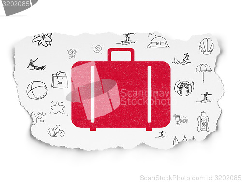 Image of Tourism concept: Bag on Torn Paper background