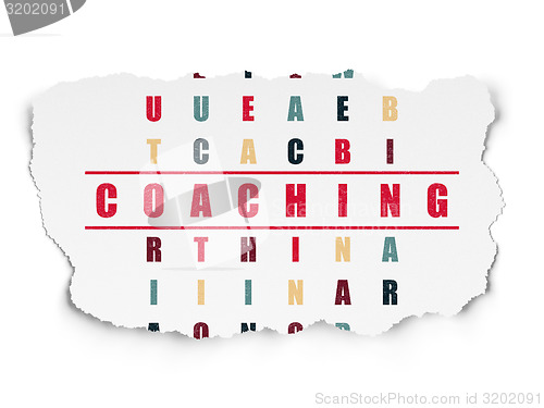 Image of Education concept: word Coaching in solving Crossword Puzzle