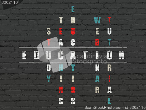 Image of Education concept: word Education in solving Crossword Puzzle