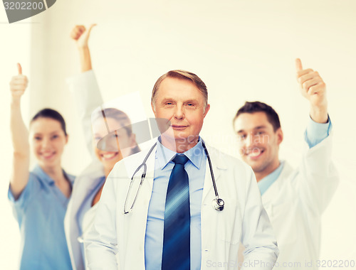 Image of smiling doctor or professor with stethoscope