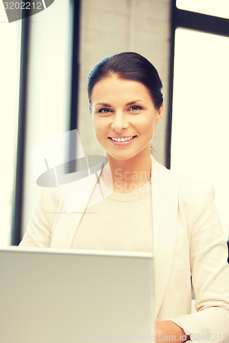 Image of happy woman with laptop computer