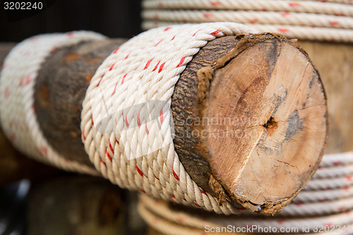 Image of wooden beam wrapped with rope