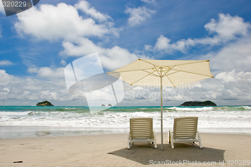 Image of Two Chairs at the Beach