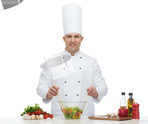 Image of happy male chef cook cooking food