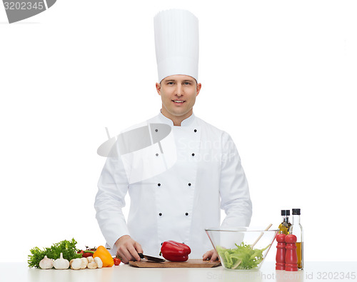 Image of happy male chef cook cooking food