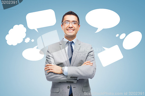 Image of happy smiling businessman in eyeglasses and suit