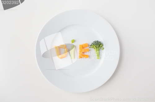 Image of close up of plate with vegetable diet letters