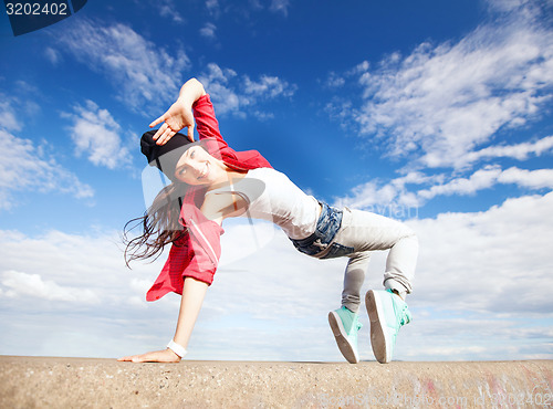 Image of beautiful dancing girl in movement