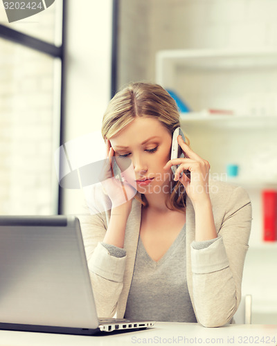 Image of businesswoman with cell phone