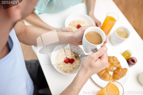 Image of close up of couple having breakfast at home