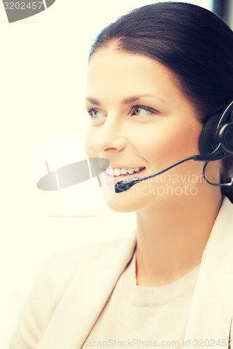 Image of friendly female helpline operator