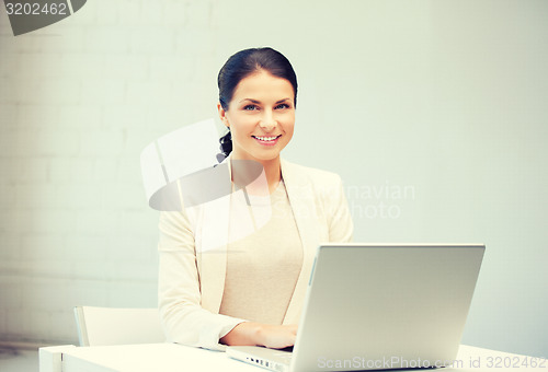 Image of happy woman with laptop computer