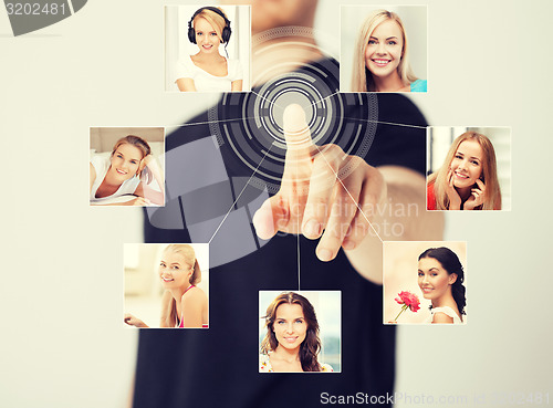 Image of man with virtual screen and contact icons