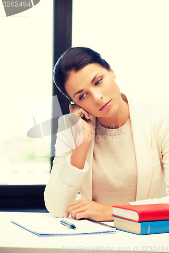Image of calm woman with book