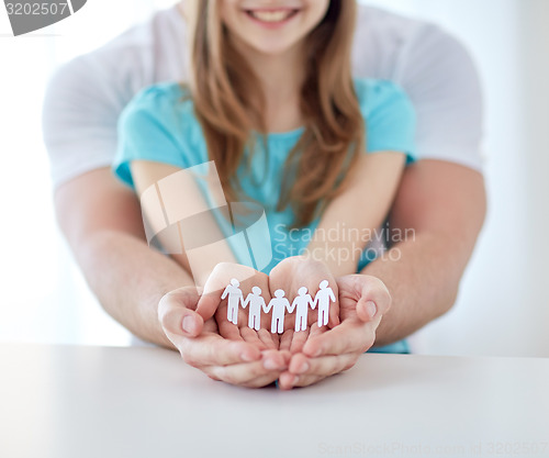 Image of close up of man and girl with cupped hands at home