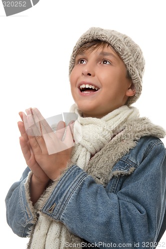 Image of Boy hands together looking up