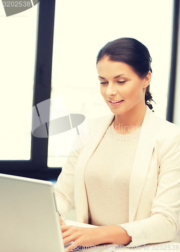 Image of happy woman with laptop computer