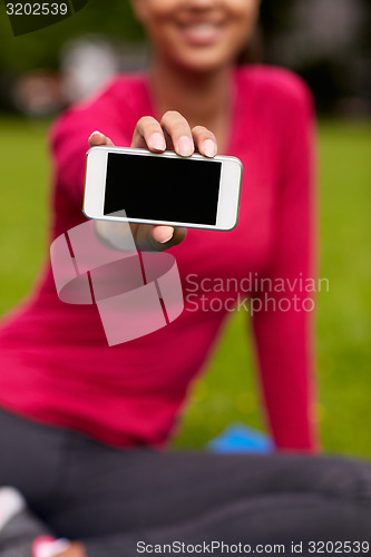 Image of close up of smiling woman with smartphone