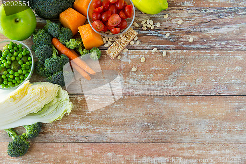 Image of close up of ripe vegetables on wooden table