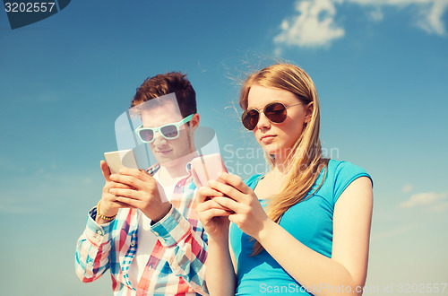 Image of smiling couple having fun outdoors