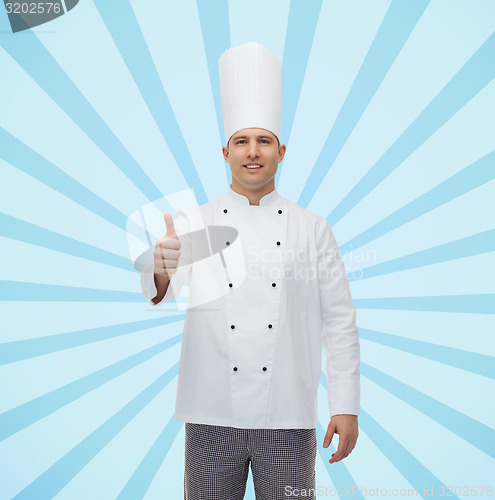 Image of happy male chef cook showing thumbs up