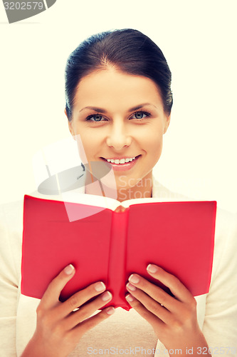 Image of happy and smiling woman with book