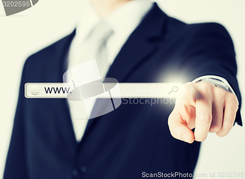 Image of businessman pressing Search button