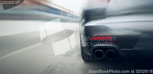 Image of close up of car riding on highway from back