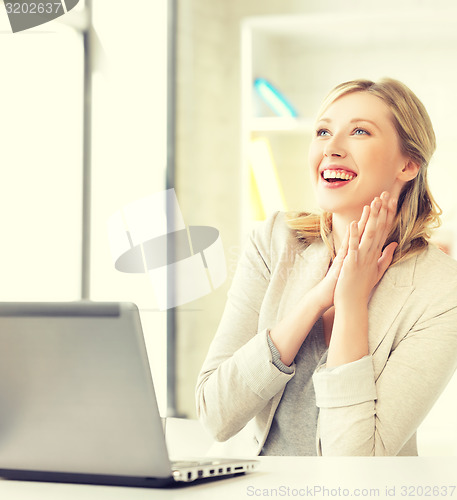 Image of happy woman with laptop computer