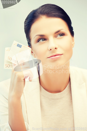 Image of businesswoman with cash money