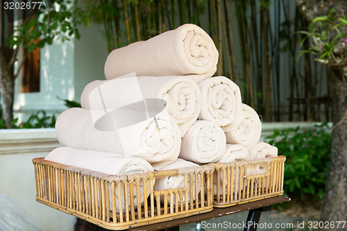 Image of rolled bath towels at hotel spa