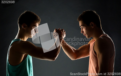 Image of young men wrestling