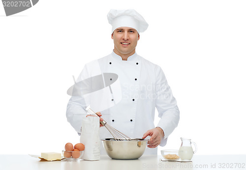 Image of happy male chef cook baking