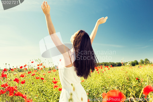 Image of young woman on poppy field