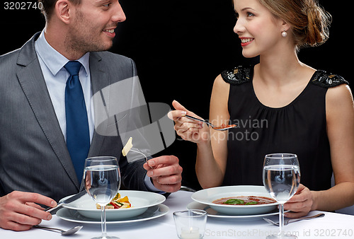 Image of close up of couple talking at restaurant