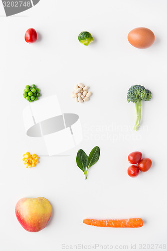 Image of close up of ripe vegetables and food over white
