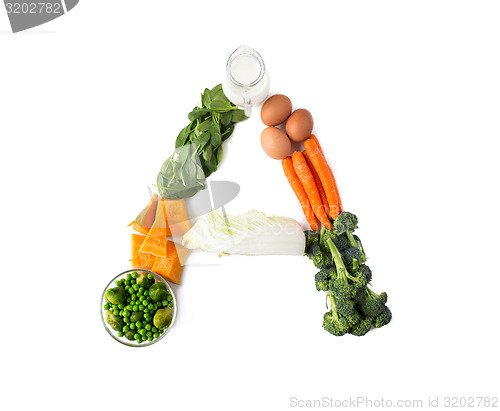 Image of close up of ripe vegetables in a letter shape  