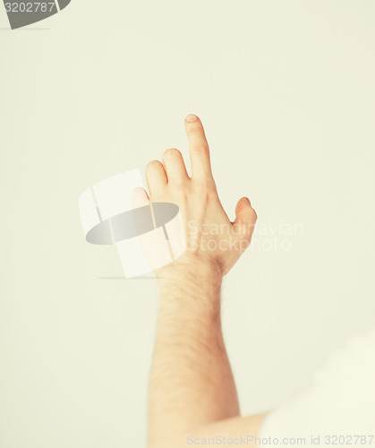 Image of man hand pointing at something