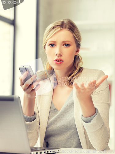 Image of businesswoman with cell phone