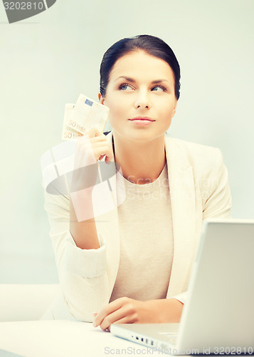 Image of businesswoman with cash money