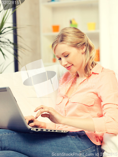 Image of happy woman with laptop computer