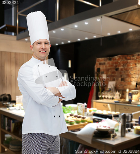 Image of happy male chef cook with crossed hands