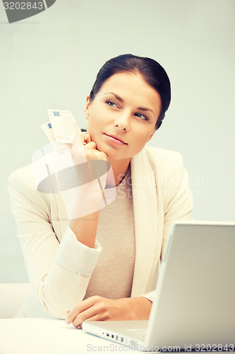 Image of lovely woman with euro cash money