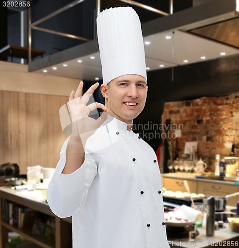 Image of happy male chef cook showing ok sign