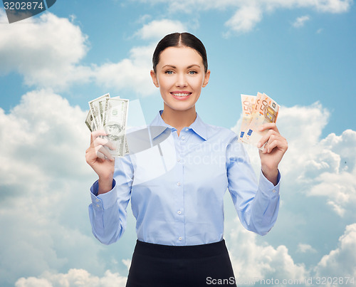 Image of businesswoman with dollar cash money