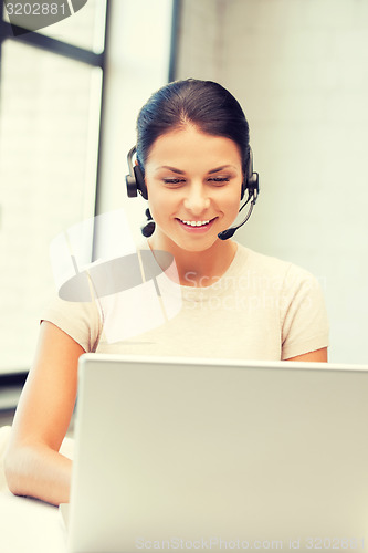 Image of helpline operator with laptop computer